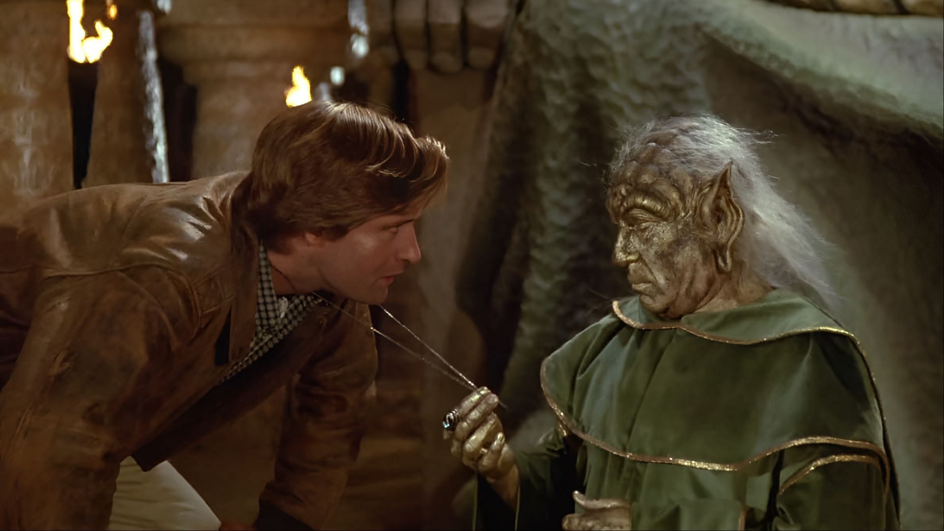 Yogurt (Mel Brooks) explains the medallion to Lone Starr (Bill Pullman) in Spaceballs, hinting at the hero’s hidden lineage. (Image via Amazon Prime)